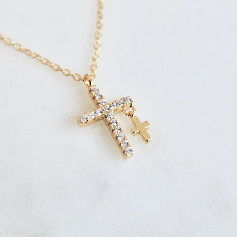 emerald-cut engagement ring halo Two crosses dainty necklace