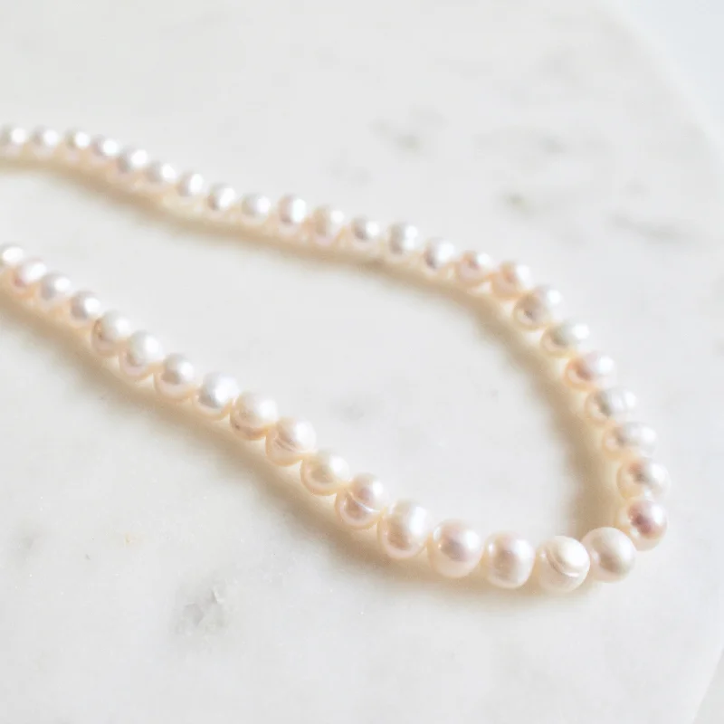 hammered gold signet ring Lover boy pearl necklace